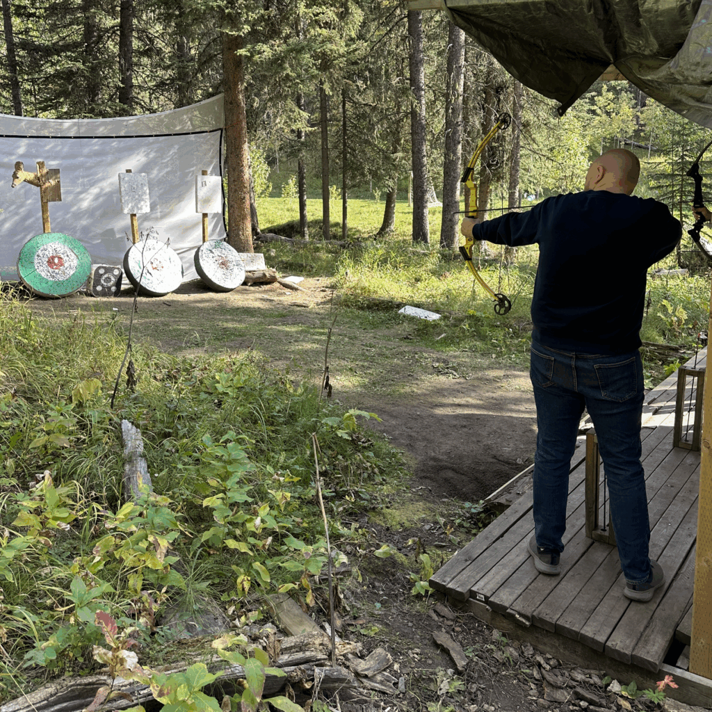 Jeff doing archery in the woods